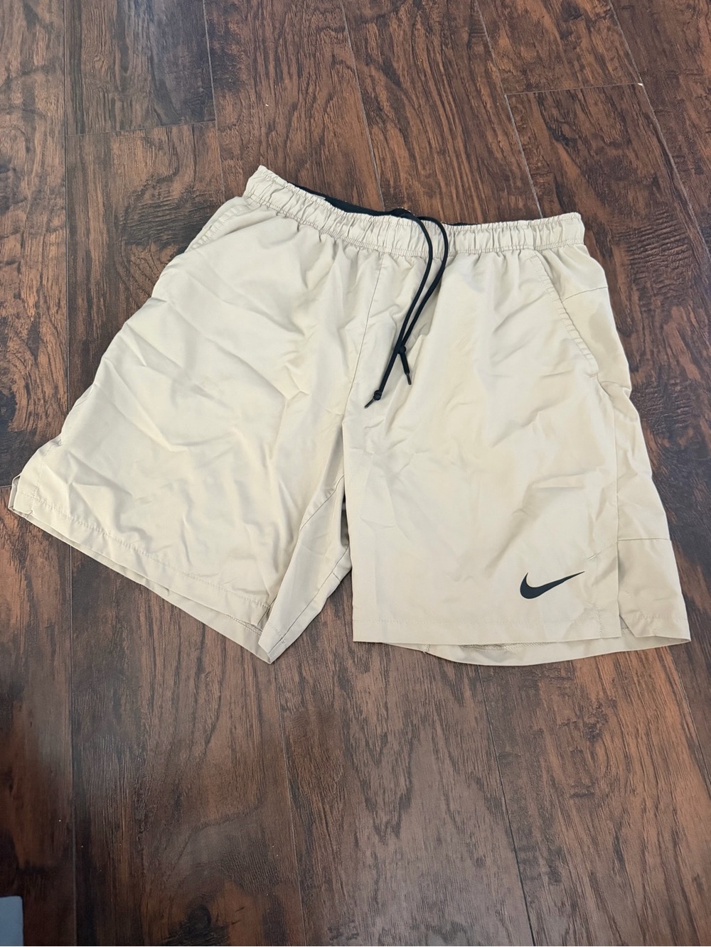 Nike Men's Light Cream Athletic Shorts with Black Drawstring